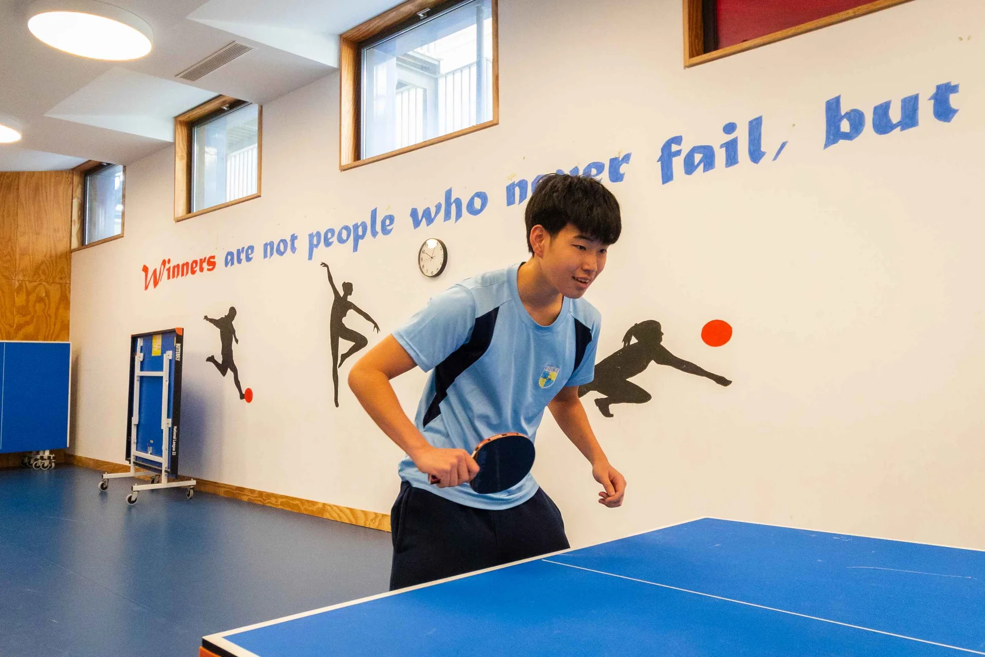Student playing ping pong