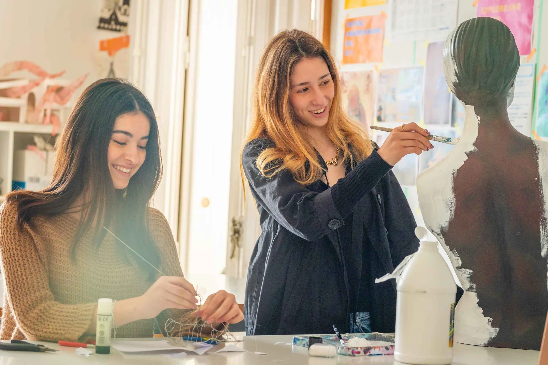 Two students painting