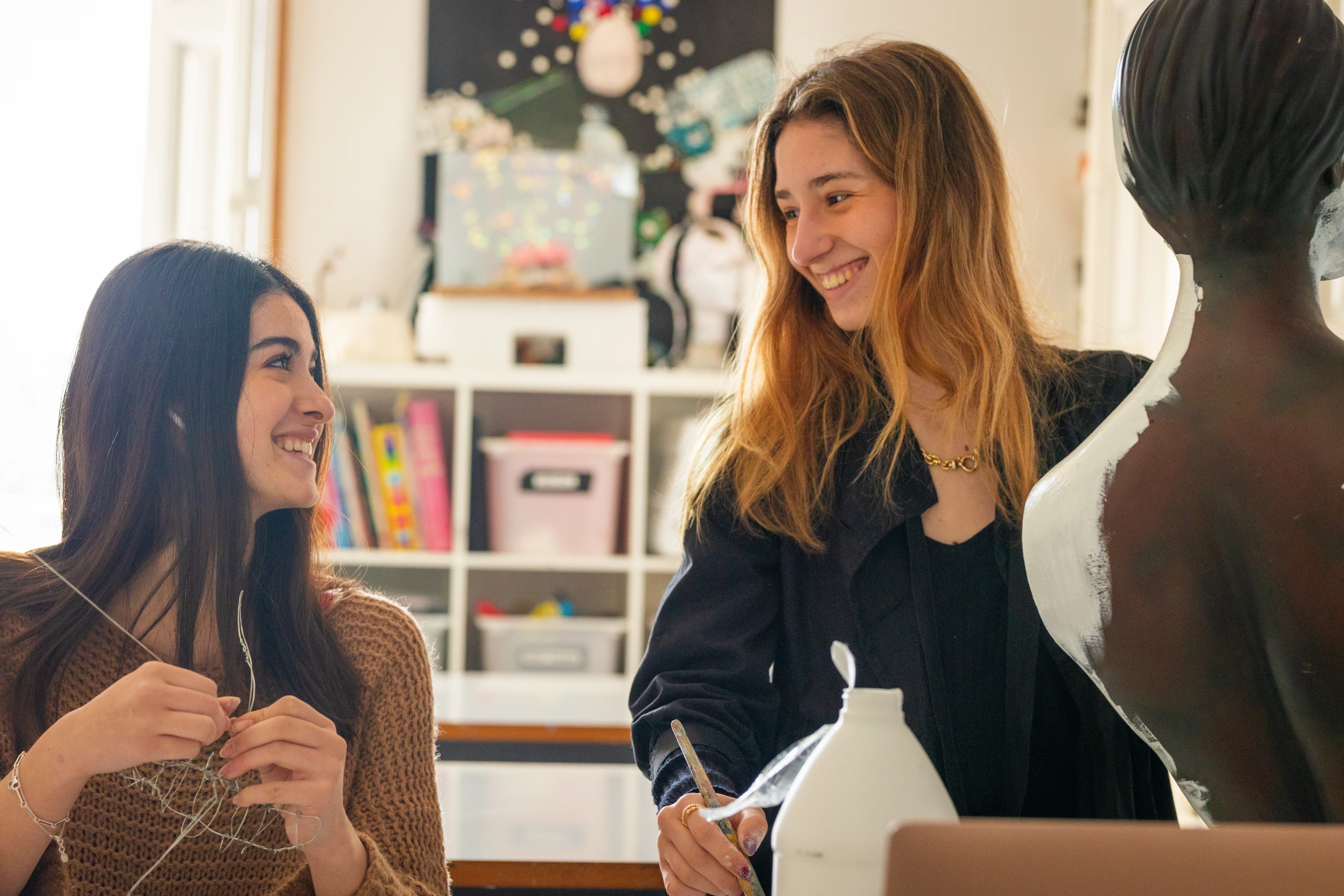 Student painting a mannequin