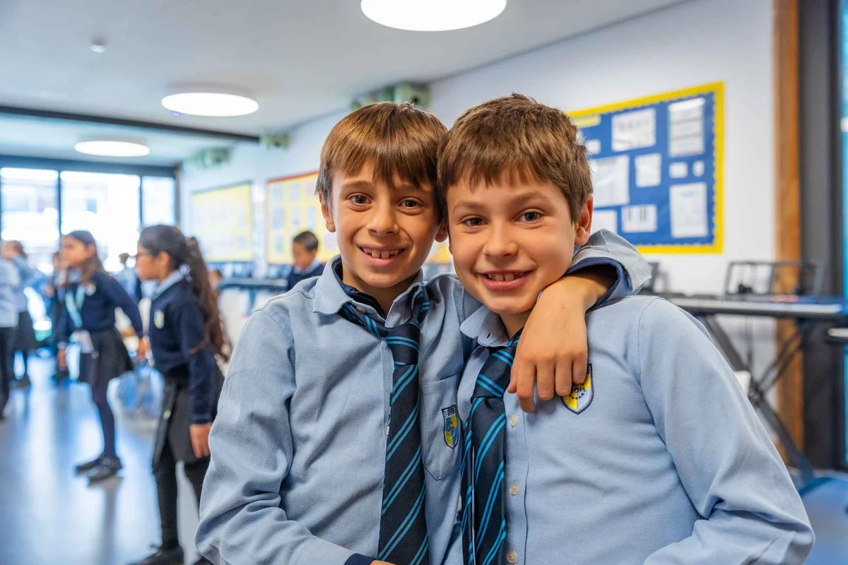 Two students hugging each other