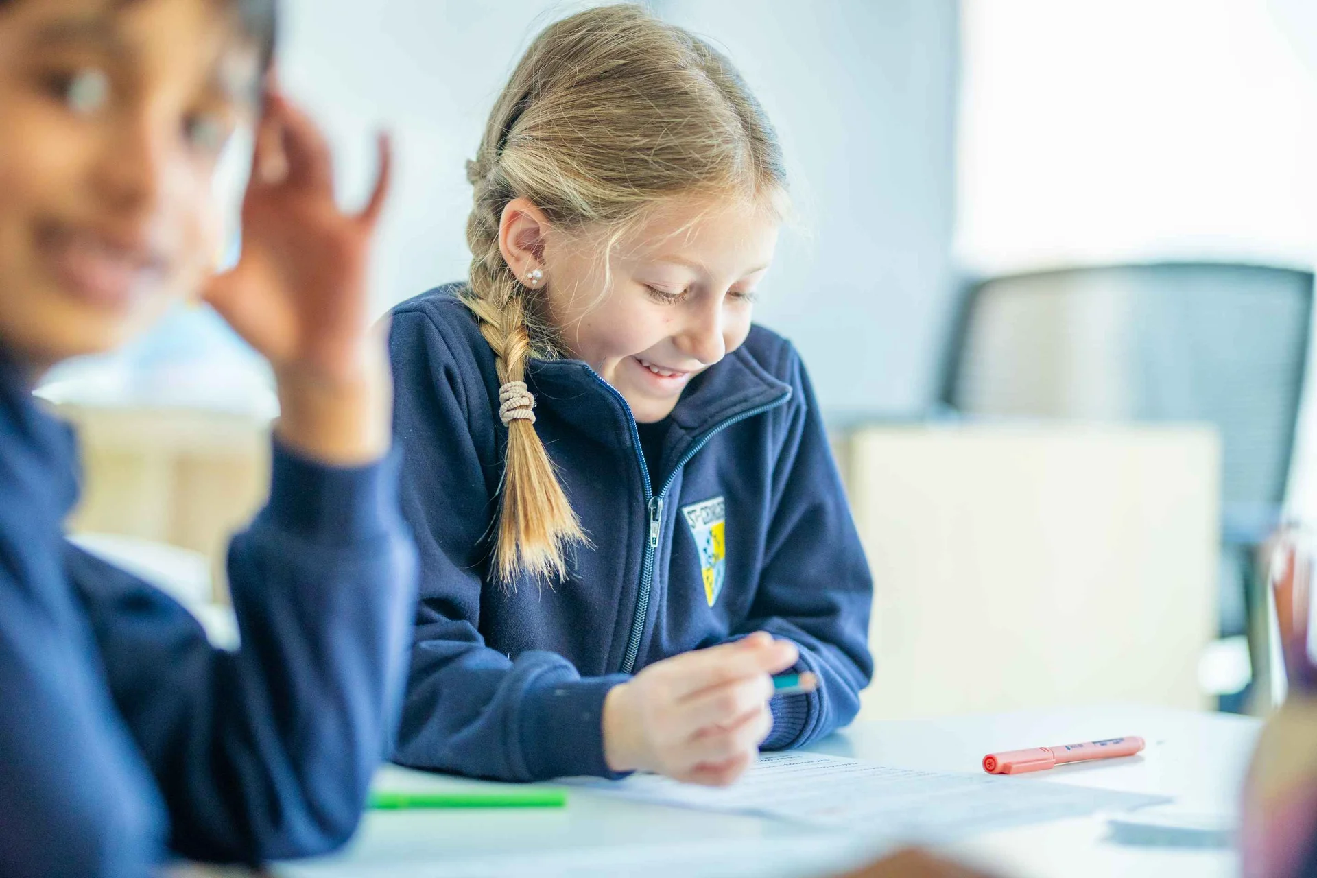 Student writing on a paper