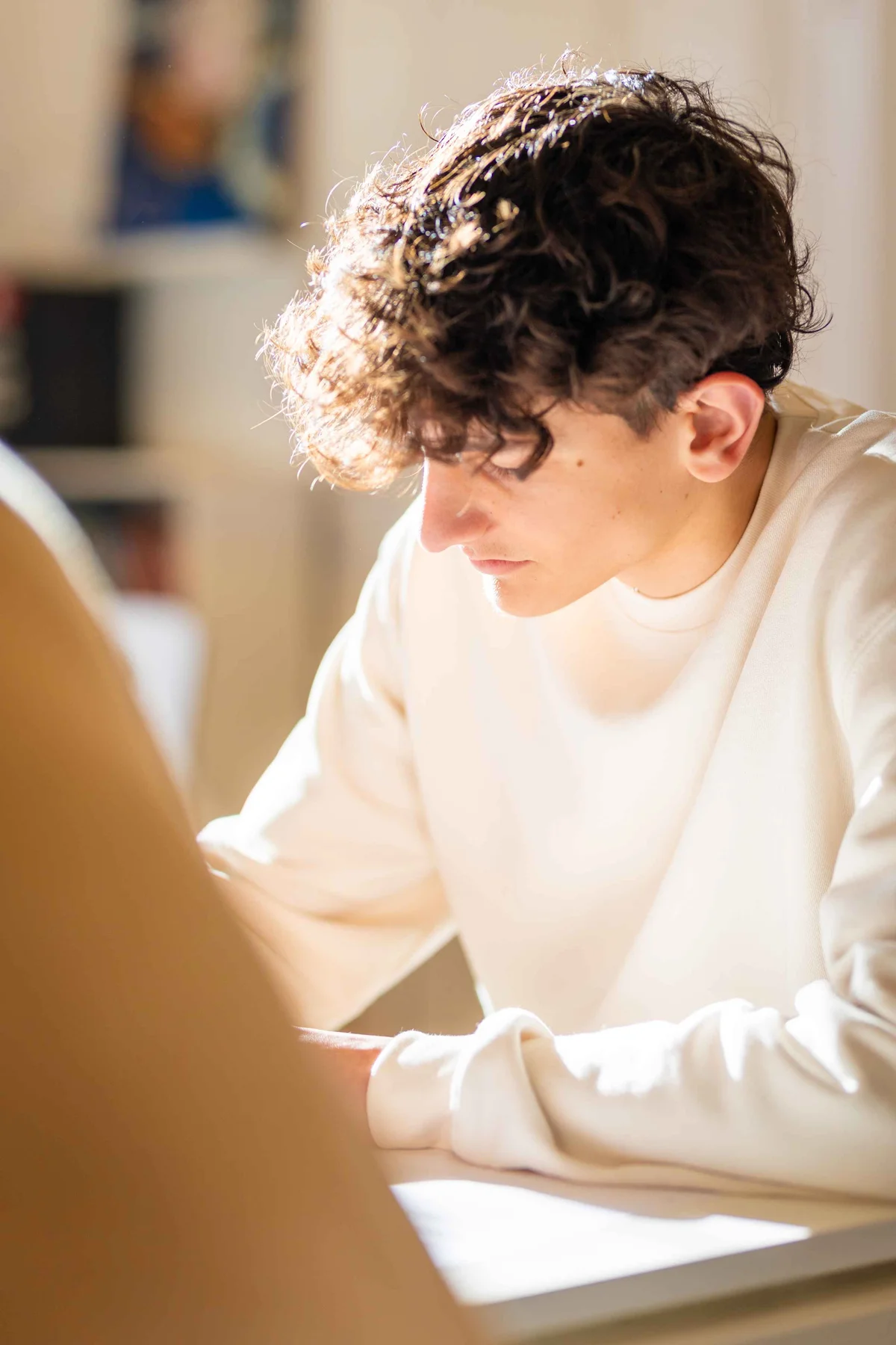 Student writing on a paper