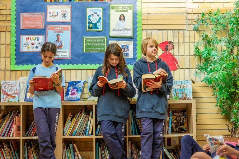 Three students reading