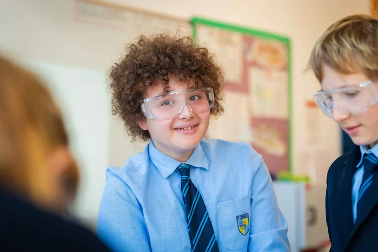 Student with a mask smiling